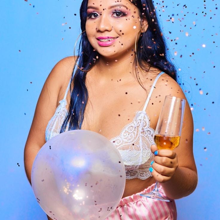 Avery Chen, Lead Design Curator at Cove Crest Harbor, reviewing corporate floral arrangements